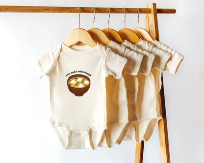 Short sleeve cotton onesie with a miso soup graphic and the text you make miso happy